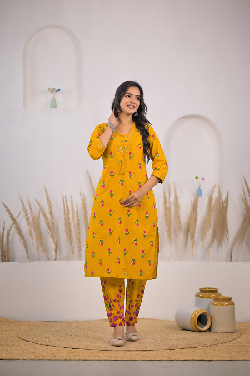 Female wearing floral mustard kurta set