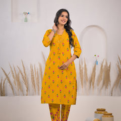 Female wearing floral mustard kurta set